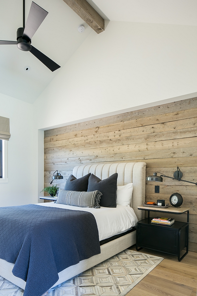 This room was designed for our son who is in college. I wanted the room to have a masculine feel that would be neutral enough to double as guest room down the road. Reclaimed barn wood was installed to bed alcove and industrial style wall lamps were added