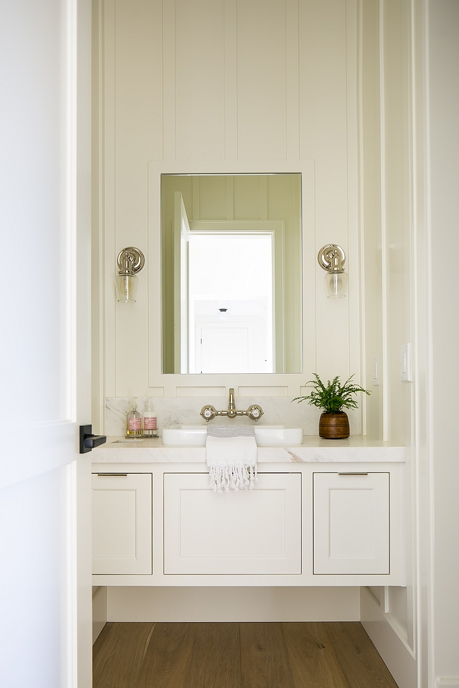 Benjamin Moore OC17 White Dove This stunning powder room features board and batten walls and a floating vanity Paint color is Benjamin Moore OC-17 White Dove #boardandbatten #paintcolor #boardandbattenPaintcolor #BenjaminMooreOC17WhiteDove