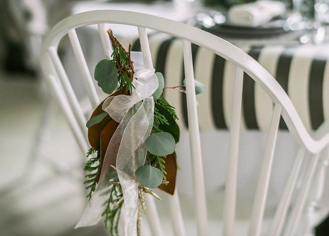 Christmas Chair Decor Natural Christmas decor behind chair Christmas Chair DecorFresh greens are always my go to when styling for the Holiday yes, they can be more work and yes, they do drop as the season winds up but for me… there is no substitute! Here a small posy of cedar, seeded eucalyptus and a magnolia tip are tied with ribbon on the chair backs #ChristmasChairDecor #NaturalChristmasdecor