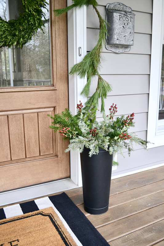 Christmas Planter Decor I filled a black container with live greenery and red berries Easy and affordable Christmas Planter Decor Ideas #ChristmasPlanter #ChristmasPlanterDecor