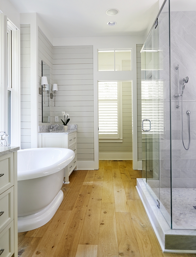 Bathroom hardwood floor Best hardwood flooring for bathrooms A low-sheen hardwood flooring adds warmth to this beautiful master bathroom #Bathroomhardwoodfloor #Bathroomhardwoodflooring #Bathroom #hardwoodflooring