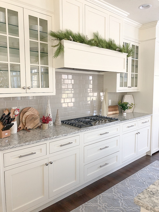 Off white kitchen painted in White Dove by Benjamin Moore with grey subway tile