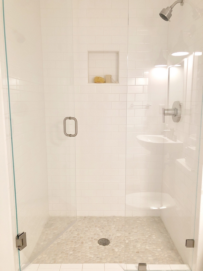 Bathroom Renovation Shower Tile We redid the shower with a riverstone floor tile and white subway tile Bathroom Renovation Shower Tile #BathroomRenovation #ShowerTile