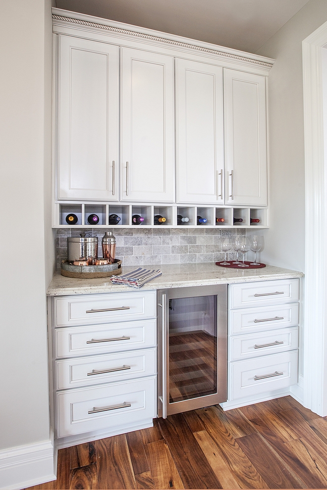 Traditional Butlers Pantry The butler's pantry features a beverage center and white granite countertop #TraditionalButlersPantry #ButlersPantry