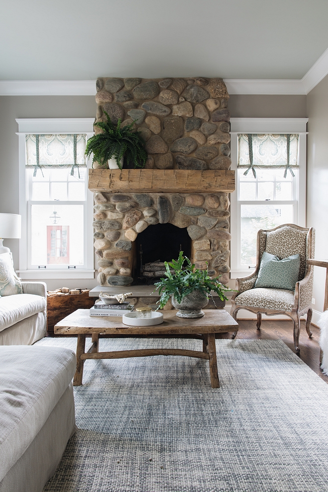 River Rock Fireplace Fireplace features natural River Rock stone and a chunky beam mantel River Rock Fireplace How to update River Rock Fireplace Just add a chunky beam mantel for an updated look #RiverRockFireplace #Fireplaceupdate #Fireplacereno #chunkymantel #chunkybeam