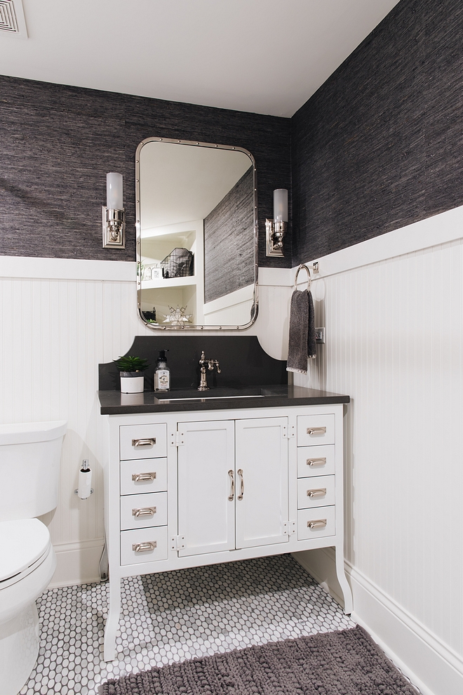 Bathroom with beadboard wainscoting, Metal Bathroom Vanity, wallpaper and oval marble mosaic floor tile #bathroom #beadboardwainscoting #wainscoting #ovalmosaictile #metalvanity