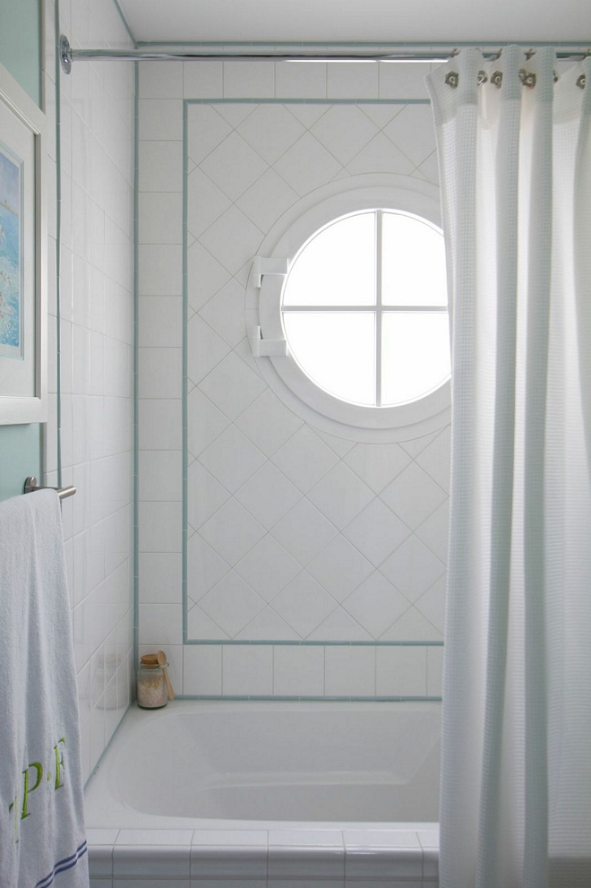 The kids' bathroom features classic 4x4 white subway tile with turquoise accent #kidsbathroom #bathroomtile #4x4tile