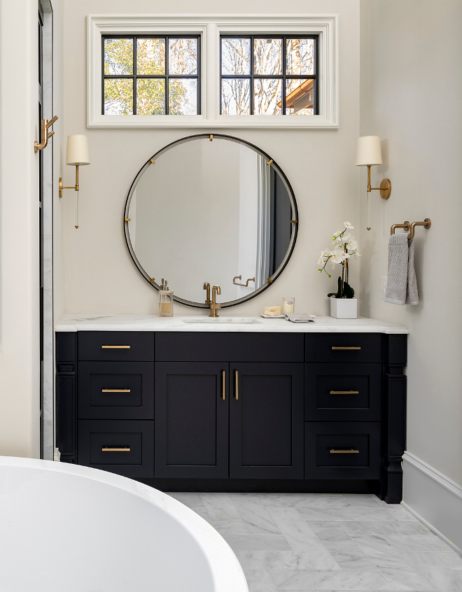Benjamin Moore Soot Bathroom Navy Cabinet Paint Color Topped with Carrera Marble and painted in Benjamin Moore Soot the vanity just pops #BenjaminMooreSoot