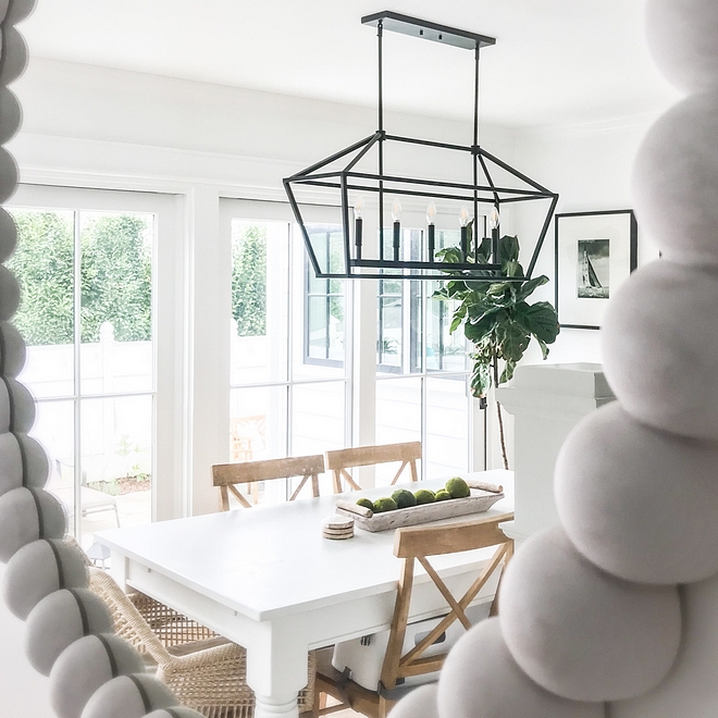 Dining room with affordable linear chandelier Coastal farmhouse dining room lighting Best lighting for dining rooms #Diningroom #affordablelinearchandelier #linearchandelier #Coastalfarmhouse #diningroom #lighting