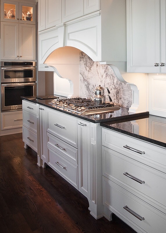 Kitchen Hood Corbels Traditional white kitchen with white curved kitchen hood accented with corbels and Quartzite slab backsplash Countertop is Black granite Kitchen Hood Corbels Traditional white kitchen with white curved kitchen hood #KitchenHoodCorbels #hoodcorbels #kitchencorbels #kicthen #kitchen #corbels #Traditionalwhitekitchen #curvedkitchenhood