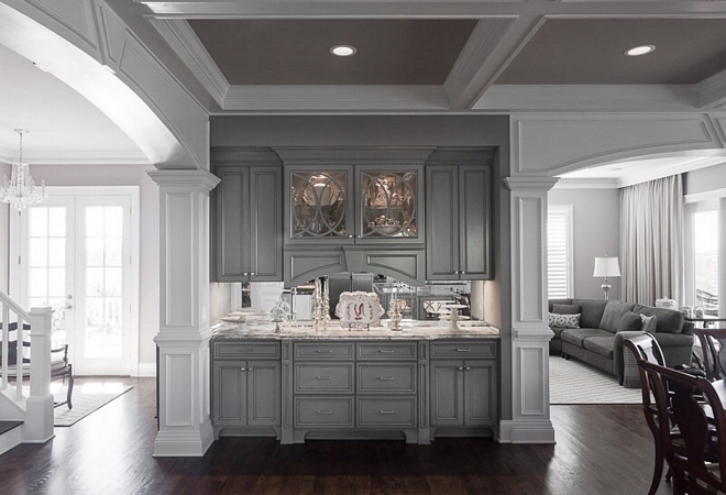 Grey Hutch Kitchen Hutch This grey hutch and the breakfast room are located on the other side of the kitchen. Notice the coffered ceiling, painted in Benjamin Moore Cobblestone, and the family room on the right #hutch #greyhutch #BenjaminMooreCobblestone