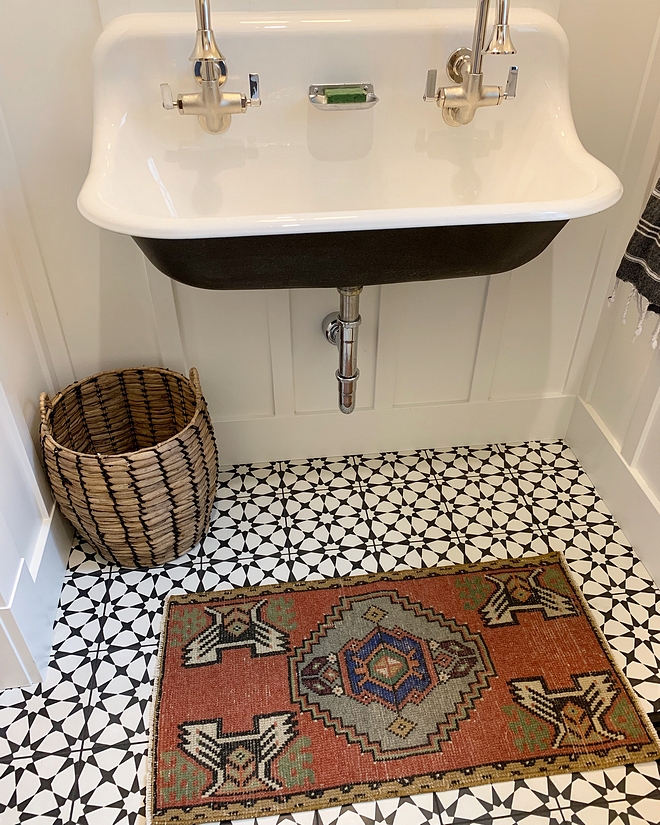 Powder room with cement tile, vintage runner and mounted sink over board and batten paneling #poderroom #cementtile #vintagerunner #wallmountedsink #boardandbatten