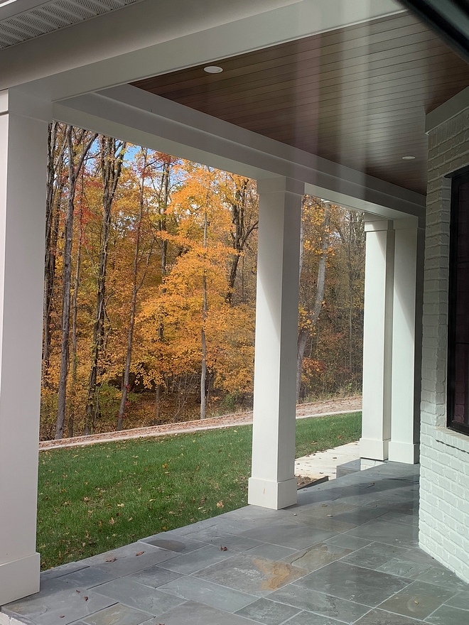 Pennsylvania Bluestone We chose Pennsylvania Blue stone for the flooring and tongue and groove stained Poplar to warm up our white exterior Pennsylvania Blue stone #PennsylvaniaBluestone #Bluestone #porchtile #porch #tile