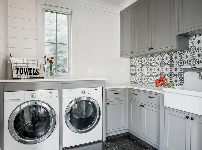 Grey laundry room The walls are clad in shiplap and cement tile and the washer and dryer are framed Grey laundry room Grey laundry room Grey laundry room #Greylaundryroom #laundryroom #shiplap #paintcolor #cementtile #framed