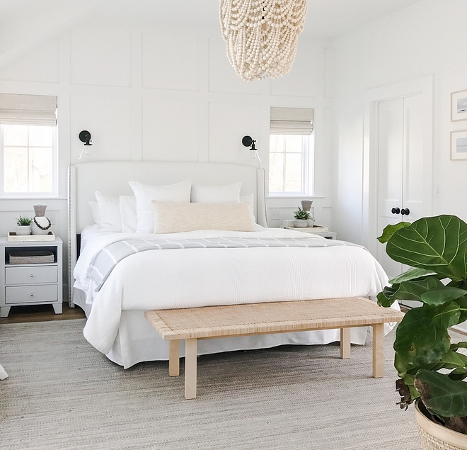 Coastal Bedroom White Bedroom Featuring white grid board and batten accent wall, vaulted ceilings, white furniture and natural elements, the master bedroom balances coastal design with an elegant approach Coastal Bedroom White Bedroom Featuring white grid board and batten #CoastalBedroom #WhiteBedroom #gridboardandbatten