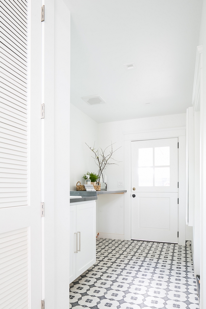 Pure White by Sherwin Williams The laundry room features white walls, painted in Pure White SW 7005 by Sherwin Williams and black and white cement tiles #PureWhiteSherwinWilliams #SW7005 #SherwinWilliams #whitepaintcolor #paintcolor