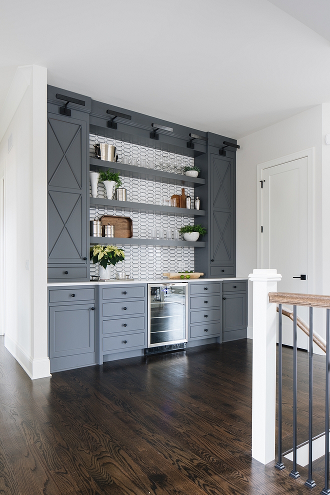 Grey bar cabinet This home also features an oversized built-in bar with beverage fridge and floating shelves Bar #Greybarcabinet #barcabinet #greycabinet #bar #cabinet