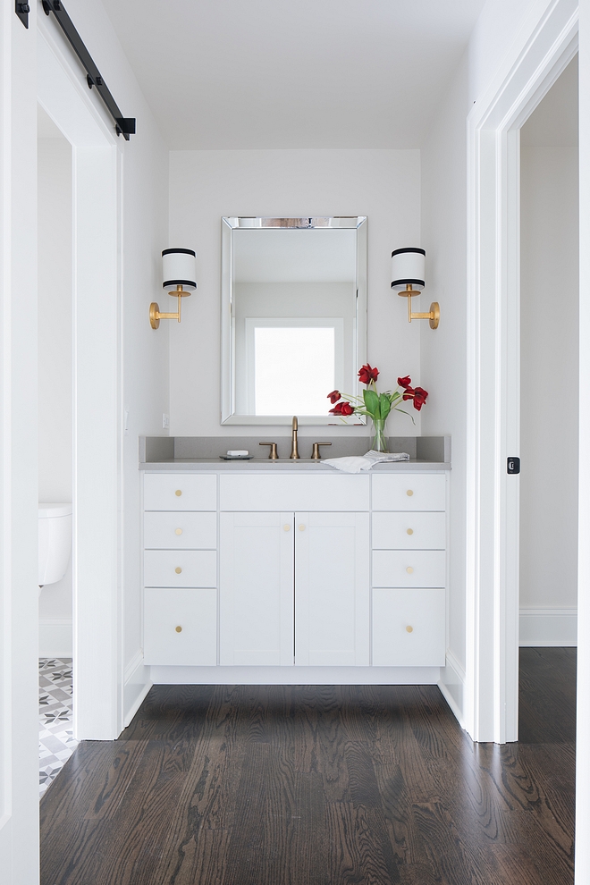 Jack and Jill bathroom This adorable Jack-and-Jill bathroom features an inspiring layout. The first vanity is located just off the first bedroom, then, a large space with the bathtub and cement tile flooring connects with the second vanity and the other bedroom #JackandJillbathroom #bathroom