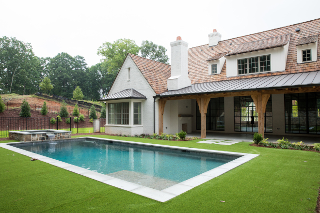 Modern farmhouse backyard with pool