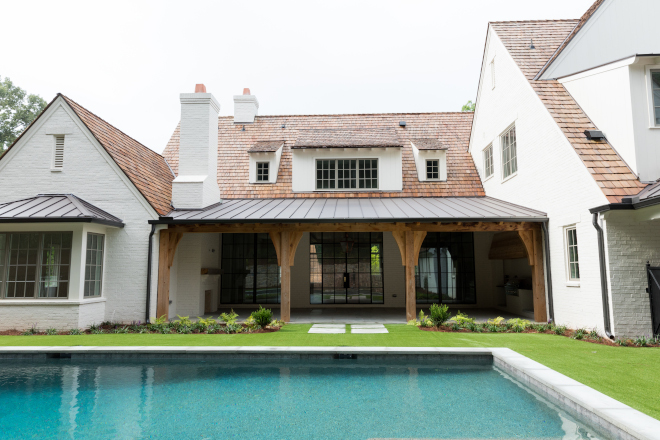 Modern Farmhouse Backyard Inspiration The back of the house features a large back porch with outdoor kitchen and outdoor fireplace