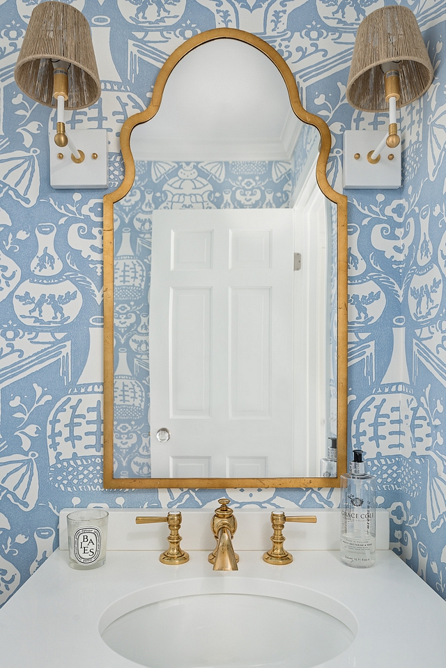 Bathroom Mirror Arched Brass Mirror against blue and white wallpaper and a pair Piper Sconces in Brass by Ro Sham Beaux Bathroom Mirror #Bathroom #Mirror