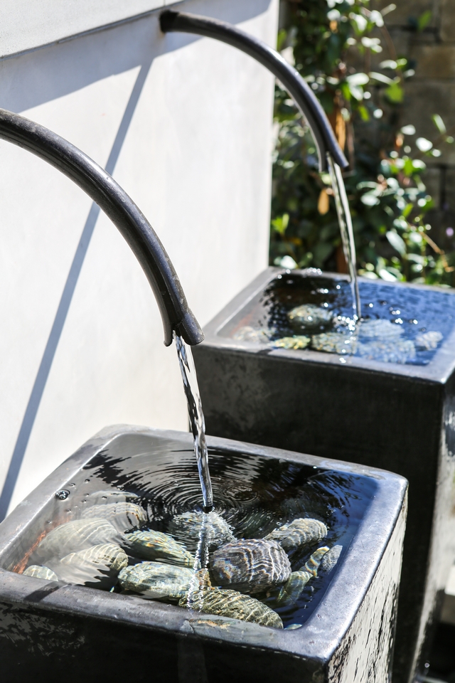 Water Fountain I am loving the rustic yet modern look of these fountains with water spigots #fountain #waterfountain