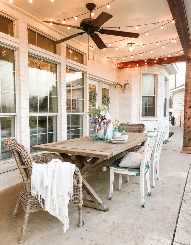Farmhouse Porch Back Porch with trestle table Farmhouse Porch Back Porch with trestle table, painted brick siding and outdoor string lights #Farmhouse #farmhousePorch #BackPorch #trestletable
