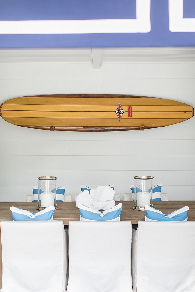 Outdoor dining area decorated with a surfboard Surfboard is from Bird Surfboards #surfboard #bidsurboards