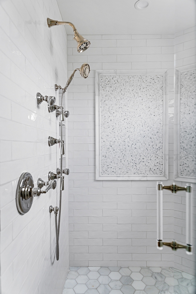 Shower Tile In addition to the sparkle the mosaics add, we dressed up a classic white subway tile with beautiful marble hex tile on the shower floor, gleaming polished nickel fixtures and a stunning lucite door handle #shower #tile