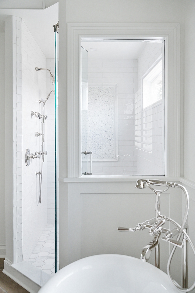 Shower Window A  large window was added facing the tub to allow you to see through to the gorgeous mosaic tile on the back wall #showerwindow #shower #window