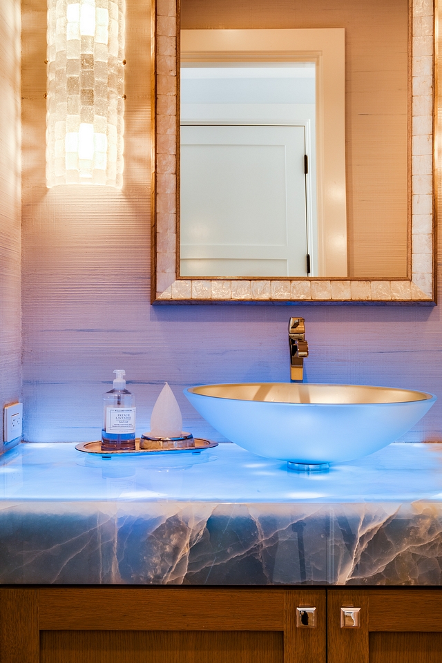 Blue Onyx waterfall counter illuminated by light strips installed under countertop Blue Onyx waterfall counter Blue Onyx waterfall countertop Blue Onyx waterfall counter ideas #BlueOnyx #waterfallcountertop #countertop