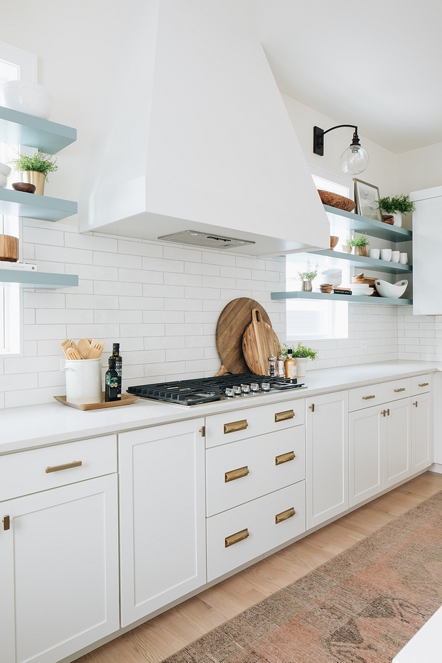 Kitchen hood Flanked by open shelves, the sleek hood becomes the focal point for this kitchen #kitchen #hood #kitchenhood #kitchendesign #openshelves