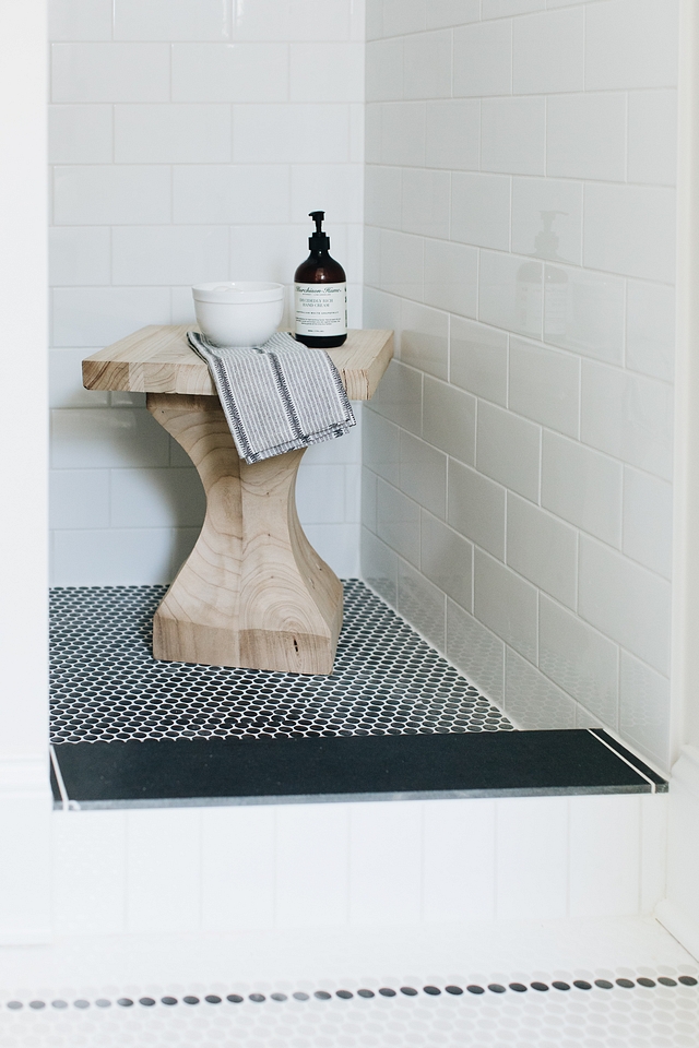 Shower features black Penny tile on shower pan and a white subway tile on walls #showertile #shower #tile #showerpan #walltile #pennytile #subwaytile