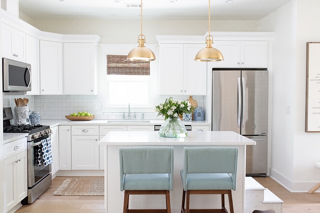 White kitchen I always have loved a clean white kitchen, so I was set on having white cabinetry and countertops. We went with flat panel, shaker cabinets accented by 3x6 white subway tile #whitekitchen #shakercabinets #whitekitchenshakercabinet #subwaytile