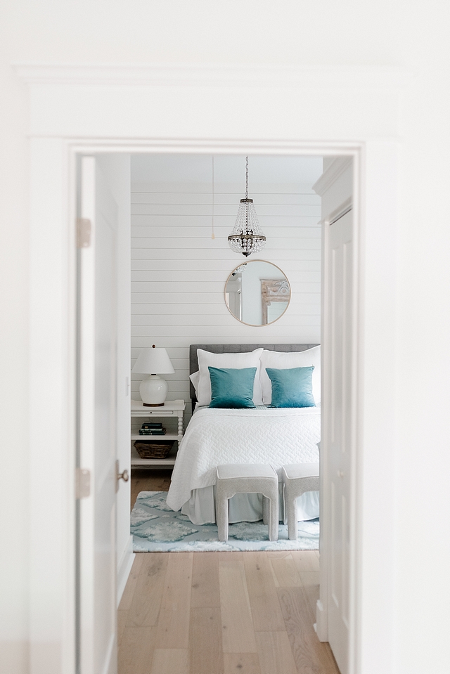 Shiplap bedroom wall I was looking for a way to cozy-up our guest bedroom, so we recently added this shiplap accent wall and hung the round mirror over the bed #bedroom #shiplap #guestbedroom #shiplapwall