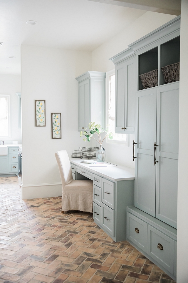 Silvermist by Sherwin Williams Silvermist by Sherwin Williams This laundry room/mudroom space is a dream, starting with the cabinet paint color, Silvermist by Sherwin Williams, and the herringbone brick flooring Silvermist by Sherwin Williams #SilvermistbySherwinWilliams