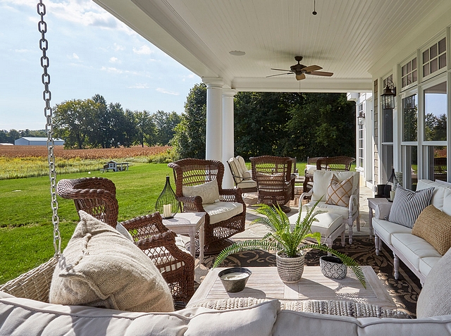 Gorgeous back porch with swing and plenty of comfortable seating #backporch #porch #porchswing