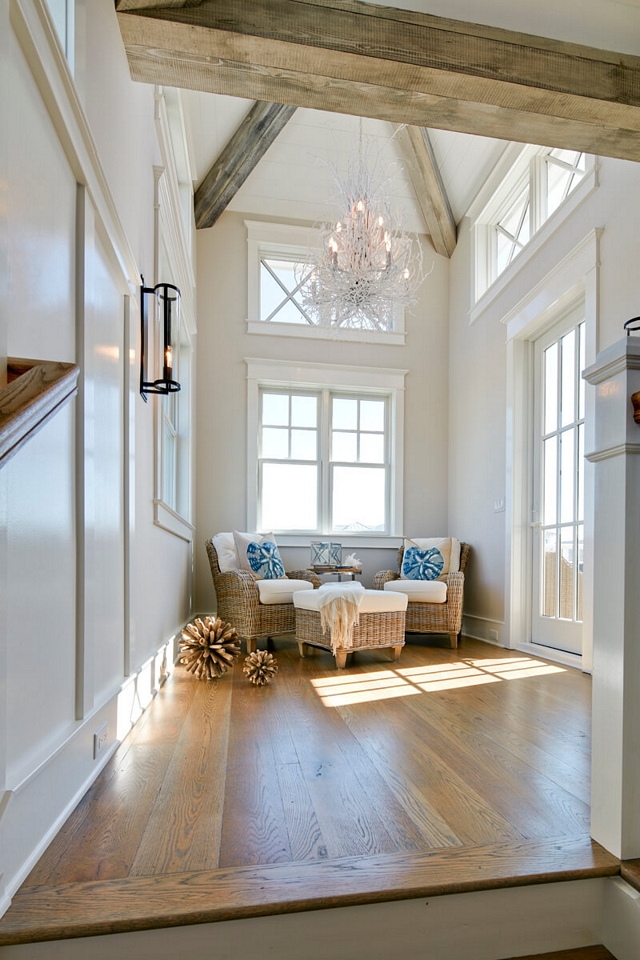 Upper landing featuring exposed beams and French doors leading to a private balcony Coastal Upper landing Coastal Homes Coastal Interiors Coastal Beach house #Upperlanding #exposedbeams #Frenchdoors #Coastal #Upperlanding #CoastalHomes #CoastalInteriors #CoastalBeachhouse #coastal #beachhouse