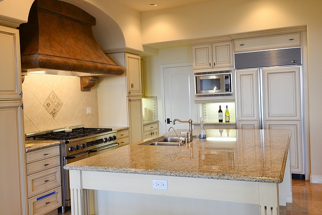 Before and After Kitchen Design The older kitchen felt dark and the "old Mediterranean" style had a heavy feel to it