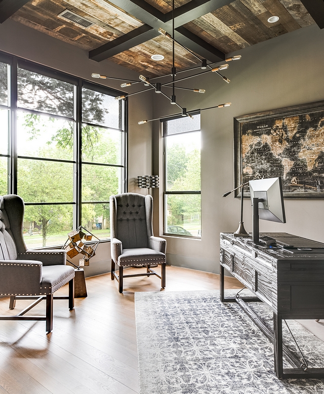 Gauntlet Gray by Sherwin-Williams This masculine home office features black steel windows and barn wood ceiling with boxed beams. Wall paint color is Gauntlet Gray by Sherwin-Williams Gauntlet Gray by Sherwin-Williams Gauntlet Gray by Sherwin-Williams #GauntletGraybySherwinWilliams