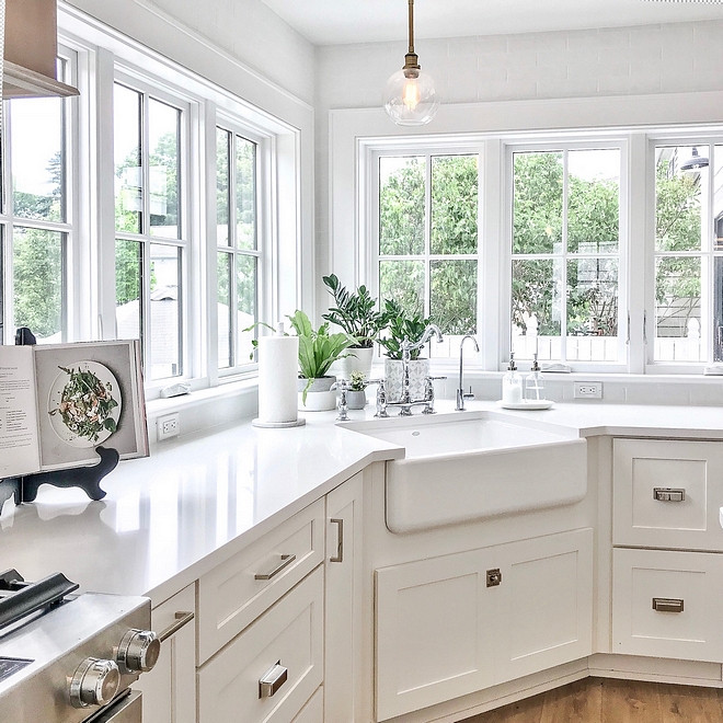 Shaker-style white kitchen cabinet with corner sink.
