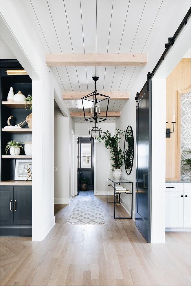 The hallway ceiling features shiplap with Knotty Alder beams