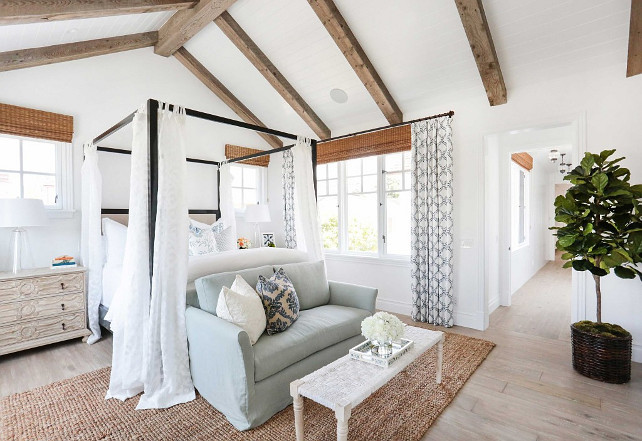 Master Bedroom. Coastal master bedroom. Coastal master bedroom with beams and vaulted ceiling, shiplap ceiling, plank floors, four-posted bed and coastal bedding and decor. #MasterBedroom #CoastalMasterBedroom Blackband Design.