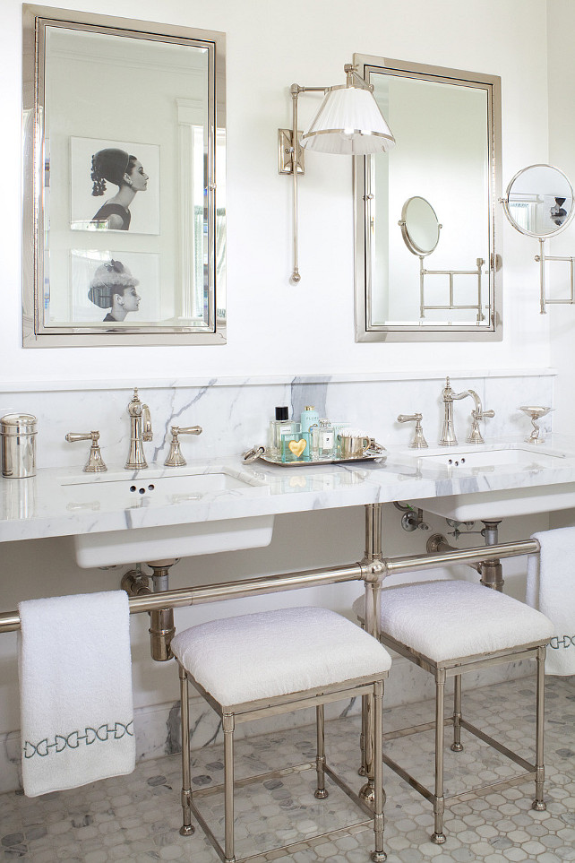 Double Vanity Bathroom. Stunning master bath with polished nickel and marble double bathroom washstands with his and her sinks and polished nickel vintage bathroom faucets. Restoration Hardware Newbury Bath Stools tucked under 3-leg bathroom vanity and marble mosaic bathroom tile floor, Restoration Hardware Framed Inset Medicine Cabinets in Polished Nickel. Restoration Hardware Asbury Extension Mirror, polished nickel bathroom sconces with white pleated shade and black and white photos of Audrey Hepburn. Anne Hepfer Designs.