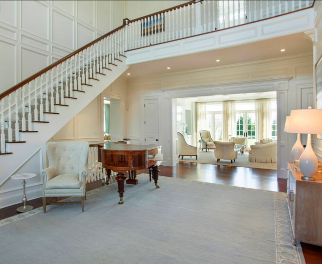 Entry Foyer Design. This classic grand double-height entry foyer leads to the elegant formal living room with coffered ceilings and fireplace. Paint Color: Benjamin Moore White Dove OC-17 #Entry #Foyer #GrandFoyer #Entryway