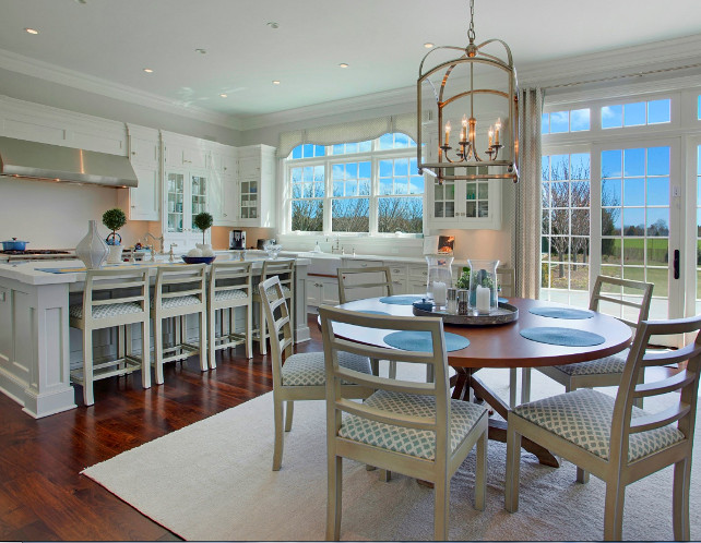 White Kitchen. This spacious white kitchen is perfect for family living, with plenty of space for cooking and family gathering. #WhiteKitchen #FamilyKitchen #Interiors