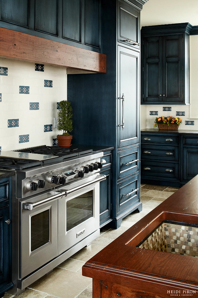 Kitchen Refrigerator. Kitchen with paneled refrigerator. The refrigerator (#700TR) is to the right of the Wolf range and freezer drawers are to the left of it (#700BF), both by Sub-Zero. #Kitchen #Refrigerator Heidi Piron Design.