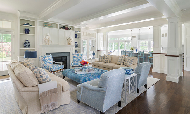 Coastal home with open main floor. The main floor of this coastal home feels open and airy. The living room opens to the kitchen. #OpenFloorplan #OpenmainFloor #OpenConcept #OpenLayout #CoastalHome Digs Design Company.