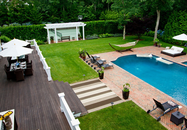 Backyard Plan Ideas. Beautiful backyard plans for the whole family. The backyard view from the upper deck shows off the pool and tennis courts.#BackyardPlanIdeas #Backyard #BackyardDesign