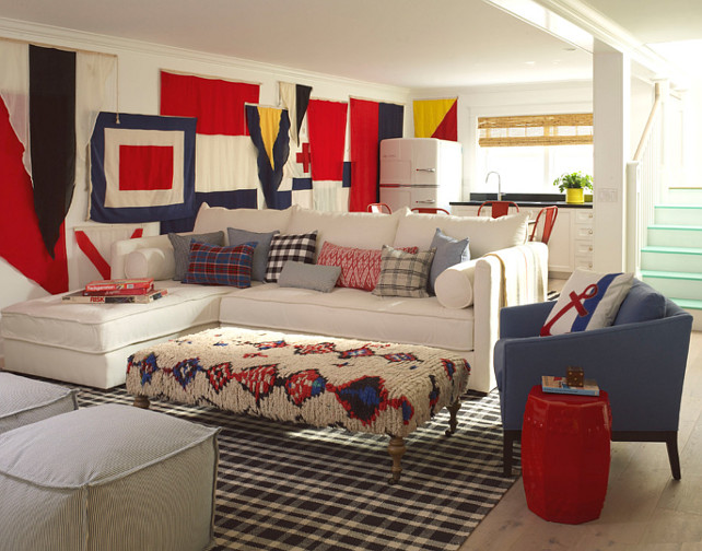 Basement Ideas. Basement decorating ideas. Basement features a wall covered in nautical flags. #Basement #NauticalFlags